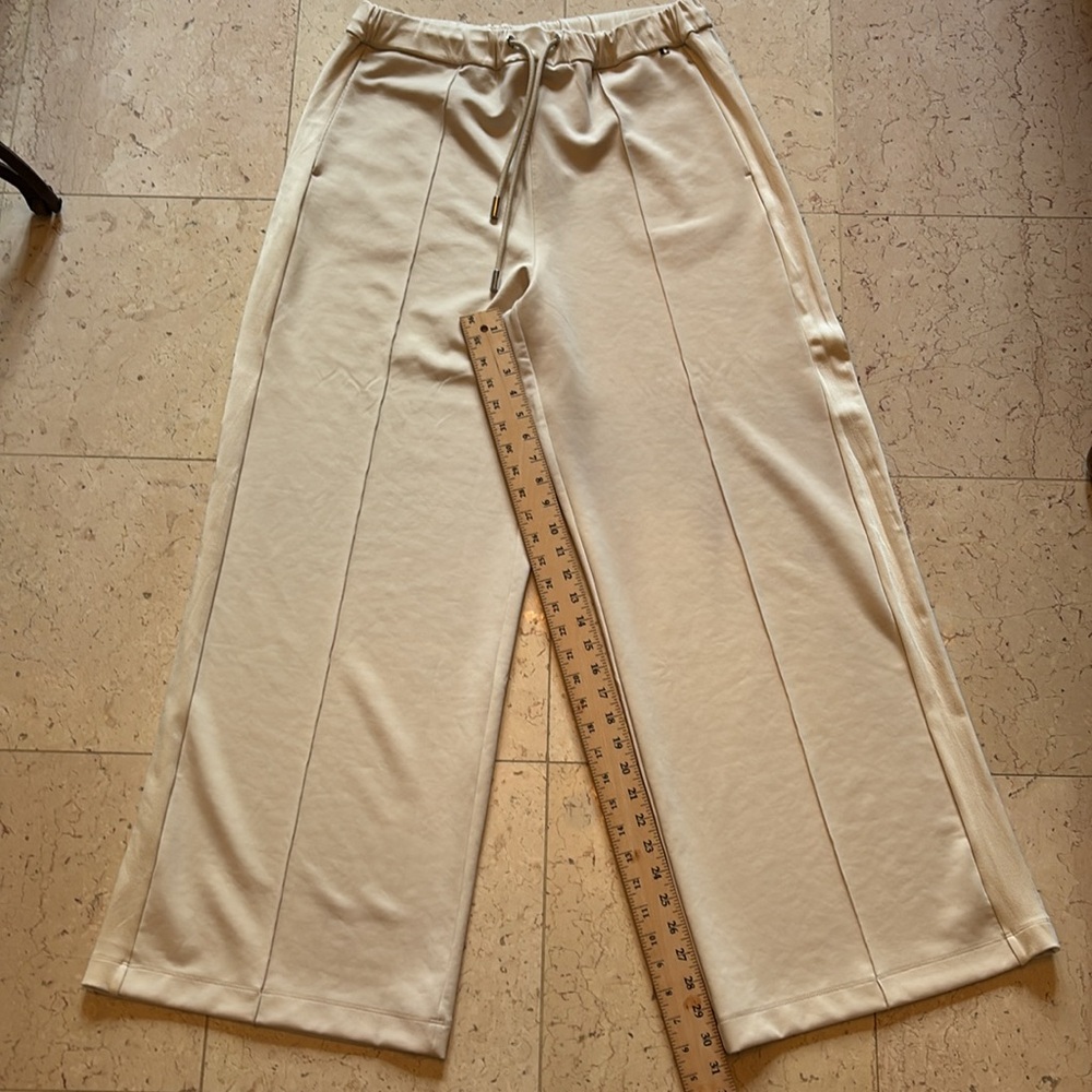 Luxurious Hugo Boss slip on pants. Cream colored elastic and tie waist worn once